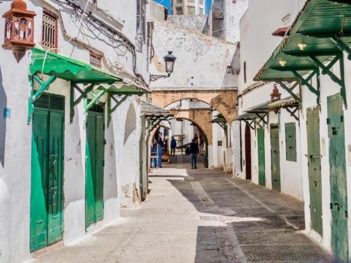 Narrow alley in Tetouan’s medina with whitewashed walls and traditional architecture.