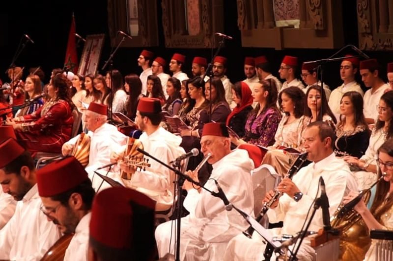 Andalusian music performance in Tetouan featuring traditional instruments and classical attire.